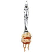 A novelty Christmas ornament shaped like a fork, with a silver handle engraved with 'MOTHER PETER NILE' and a pasta-like tip wrapped in orange-red sauce with green sprinkles, shown on a plain white background.